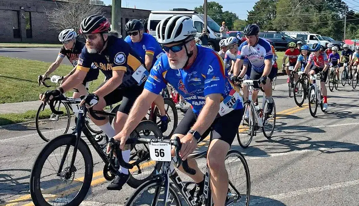 A group of cyclists riding together in a race.